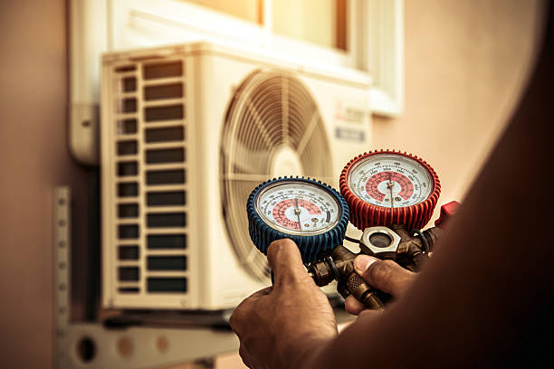 Professional Heat Pump Repair technician working in Denison, IA